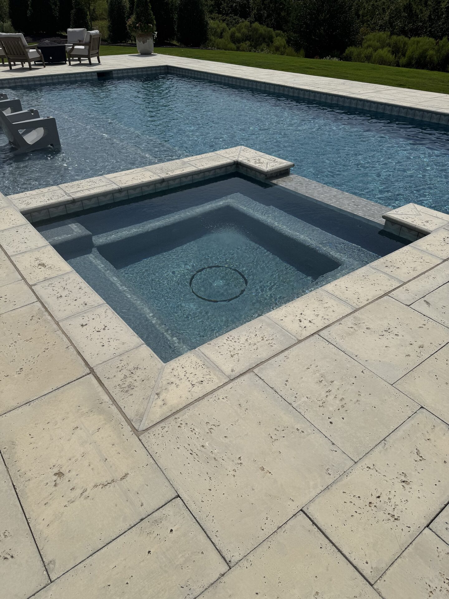 Spa detail with custom tile and stone decking