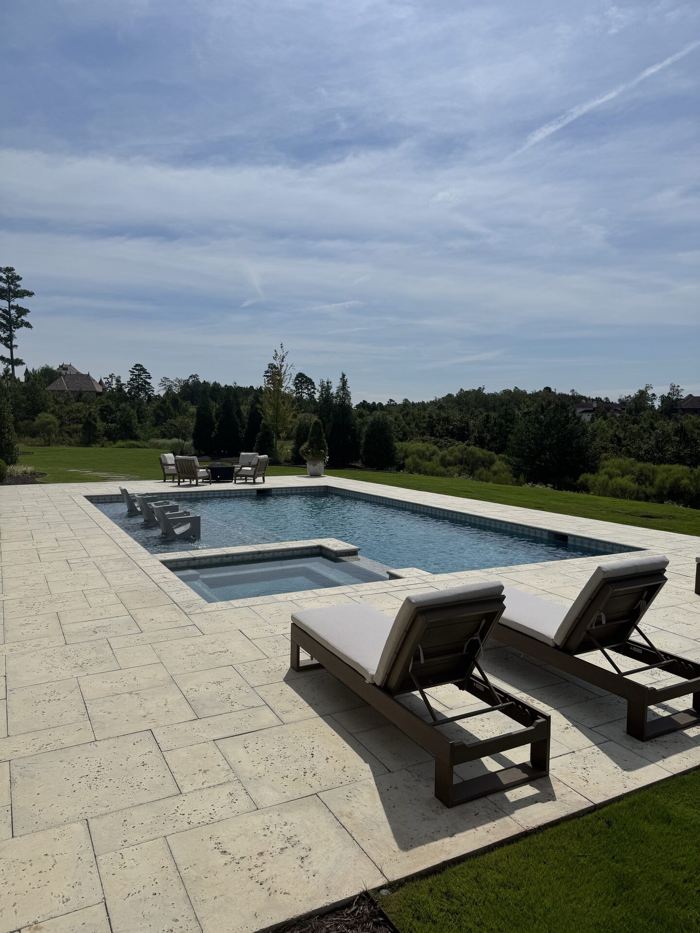 In-pool loungers and spa from the deck