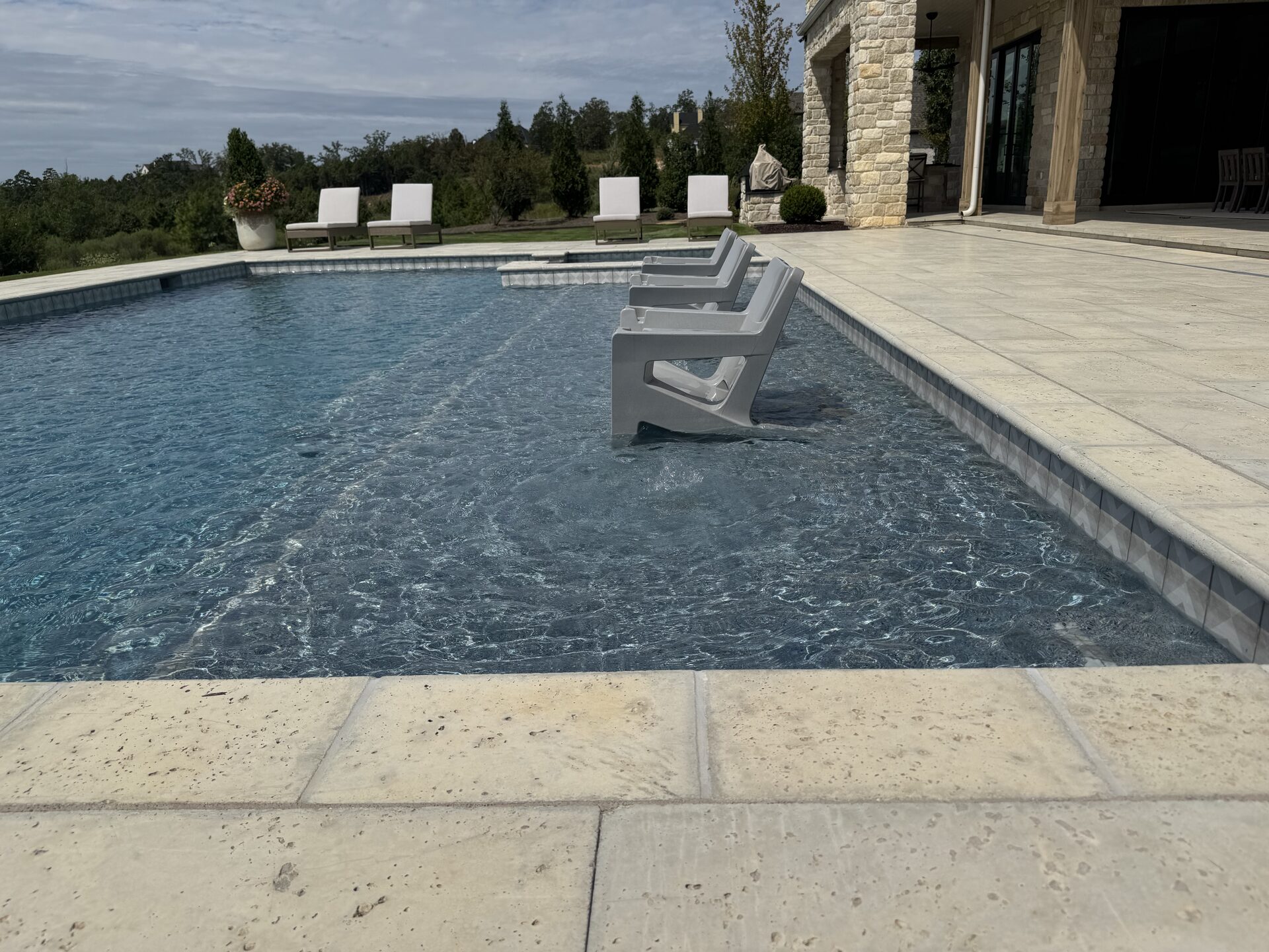 In-pool seating and ledge furniture