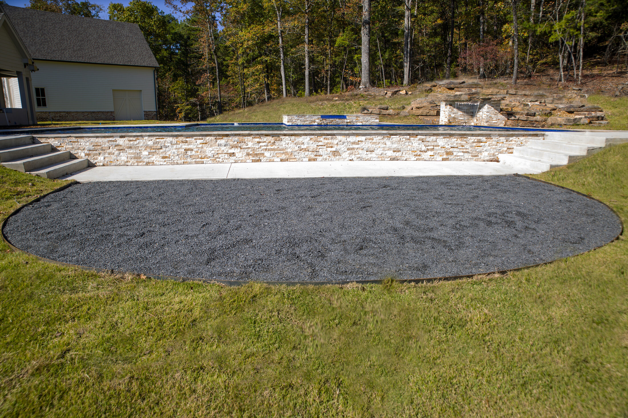 Pool and dive rock from across the yard