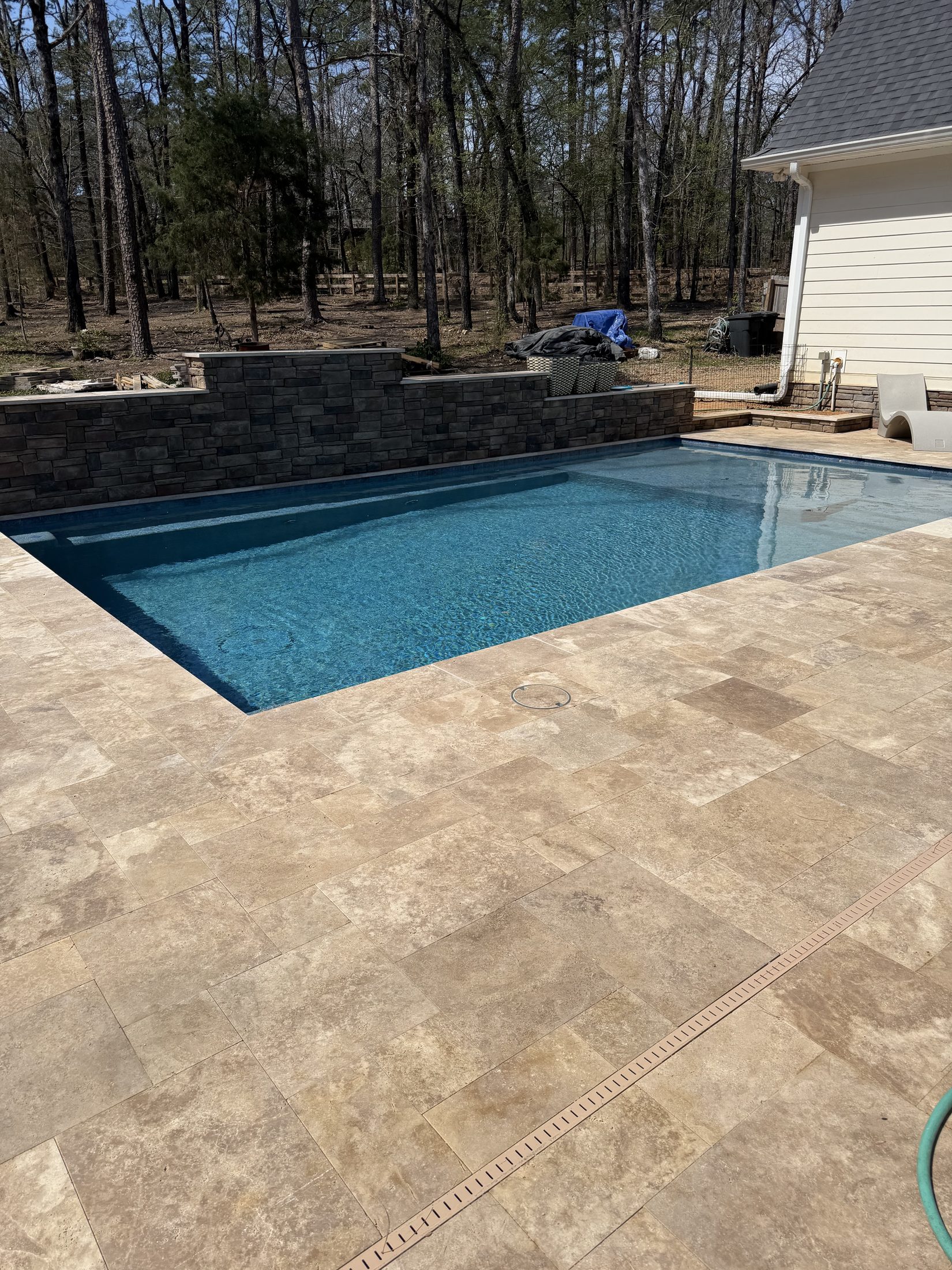 Stacked-stone wall matching the home exterior