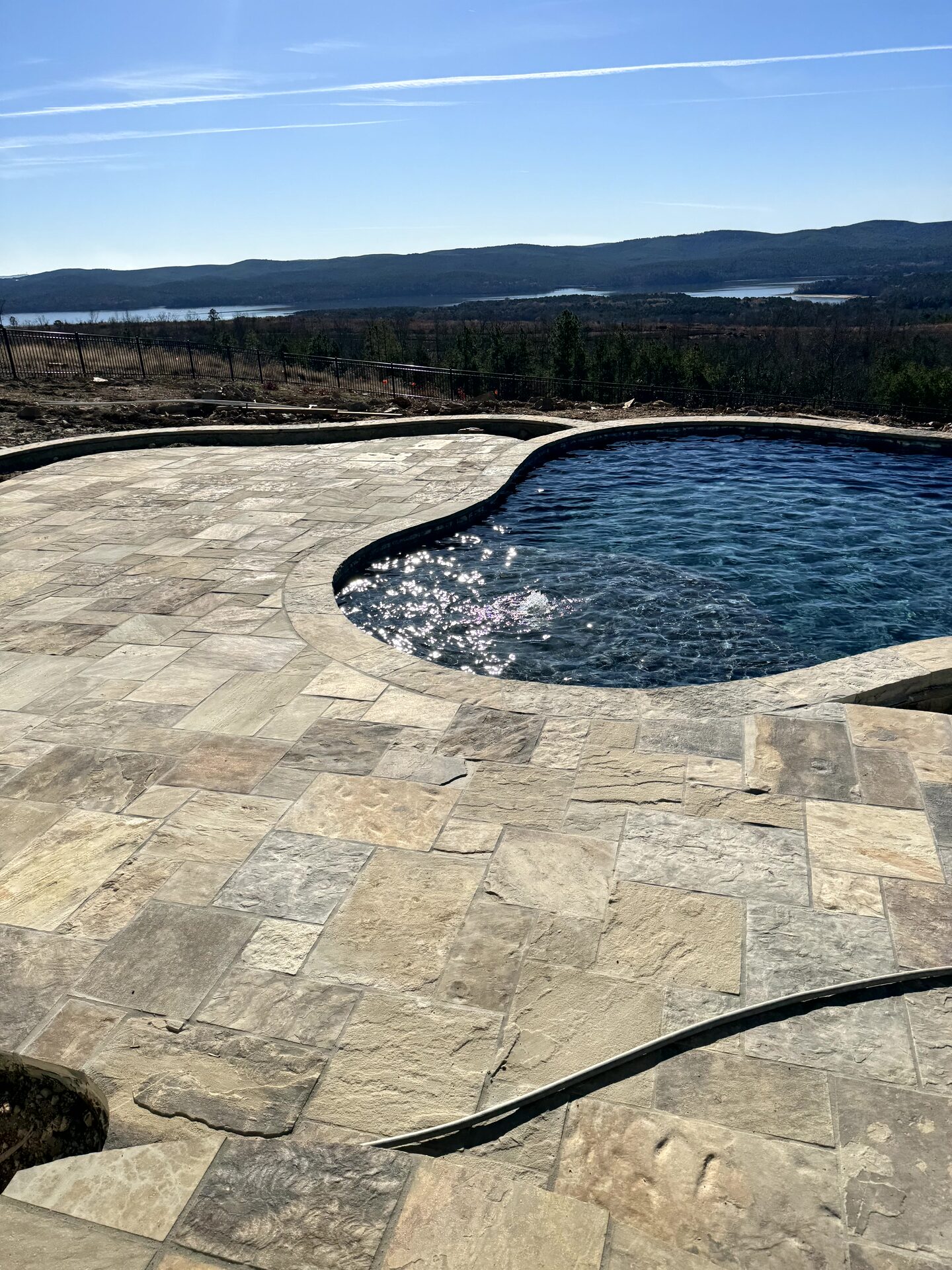 Hand-chipped stone deck detail with retaining wall