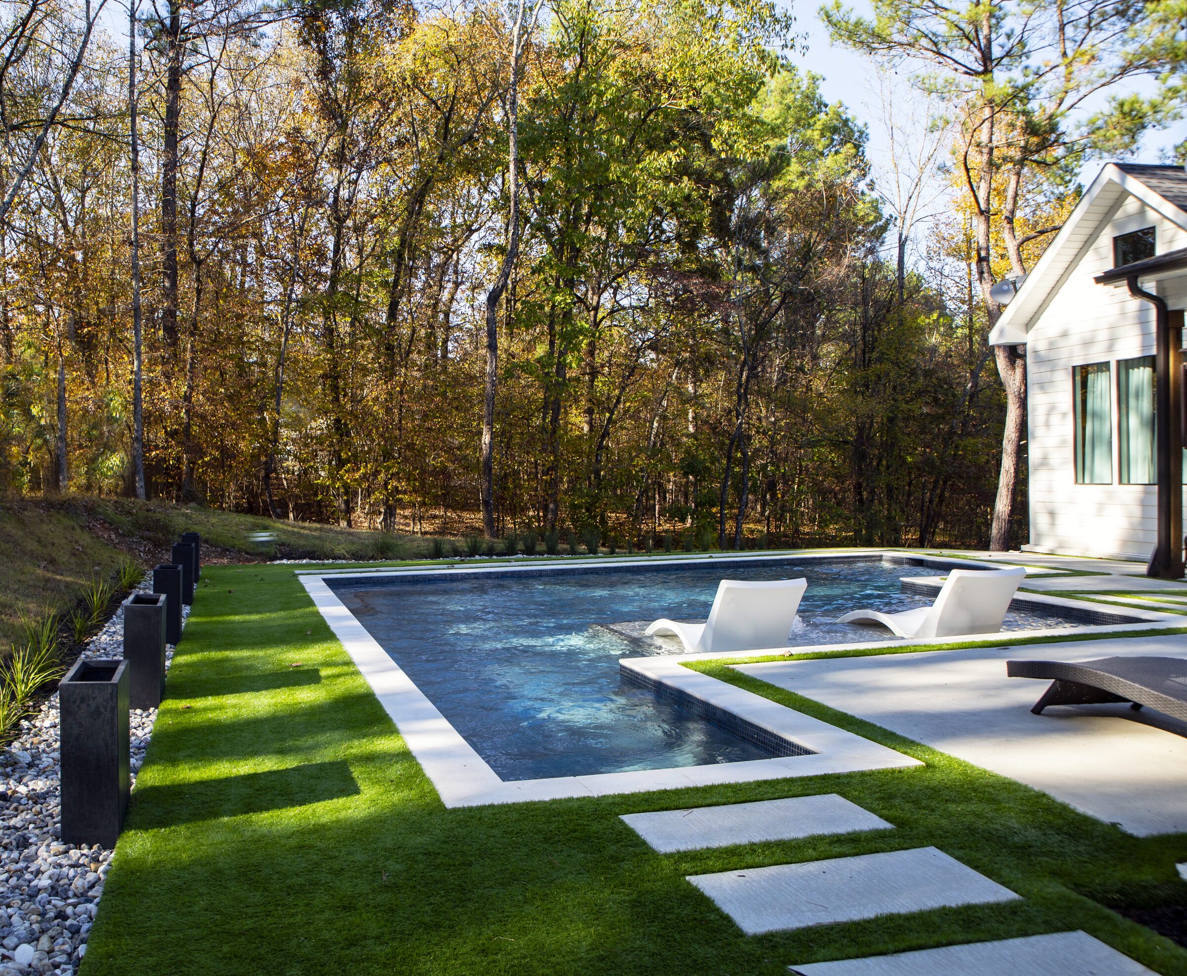 Side angle — limestone stepping pads through the turf