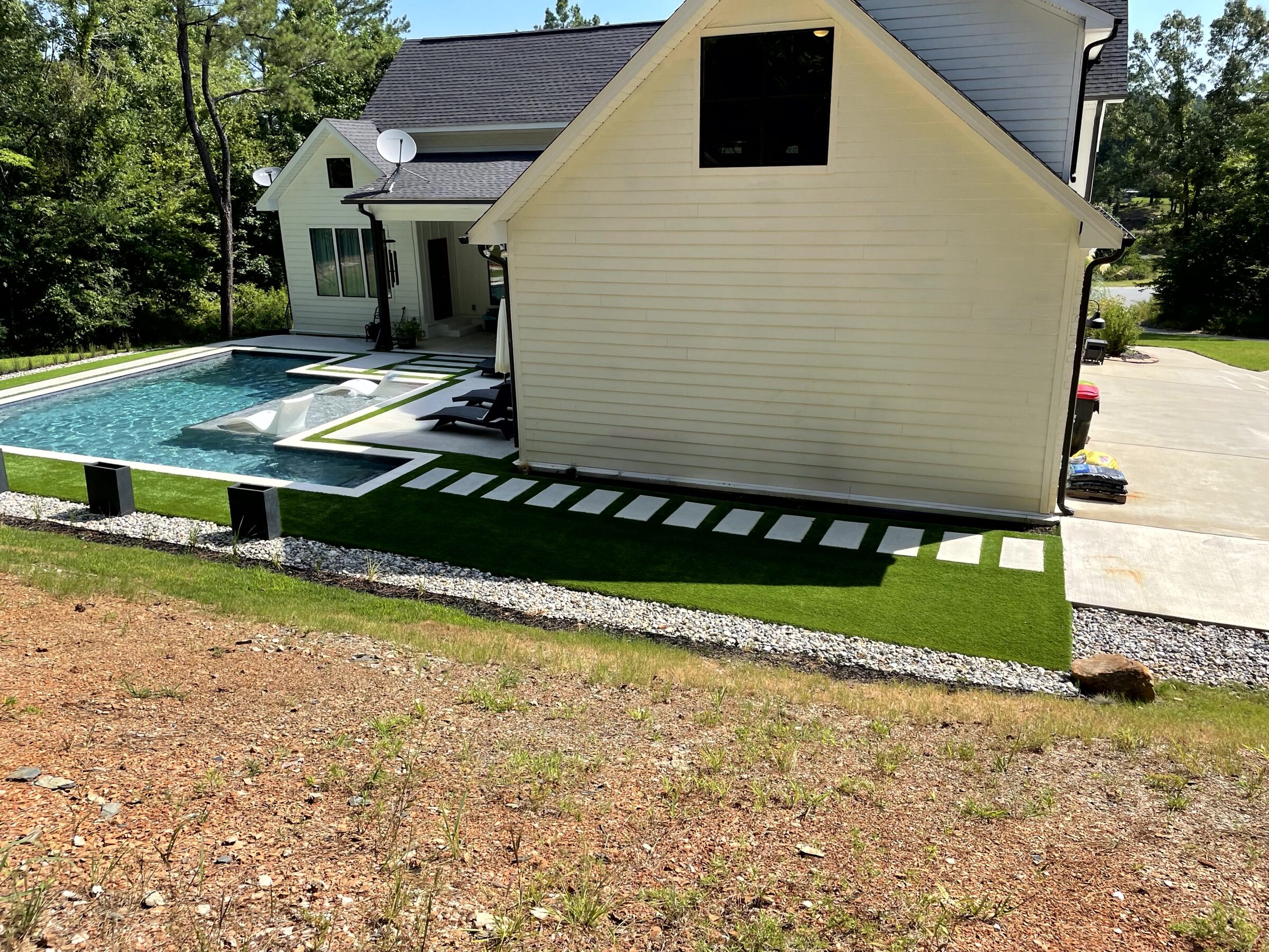 House-side view with limestone pads through the turf