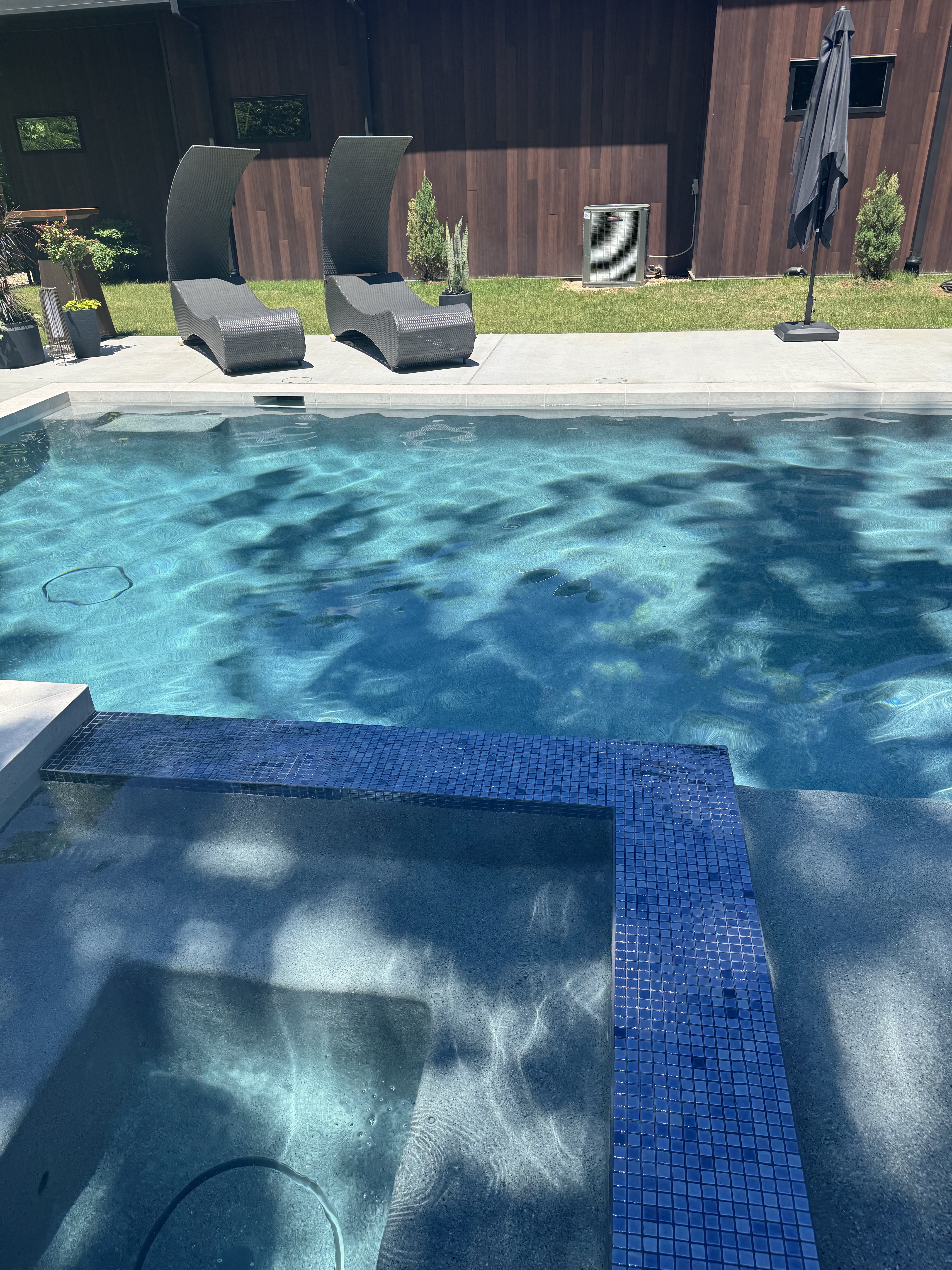 Raised spa with 1x1 tile finish