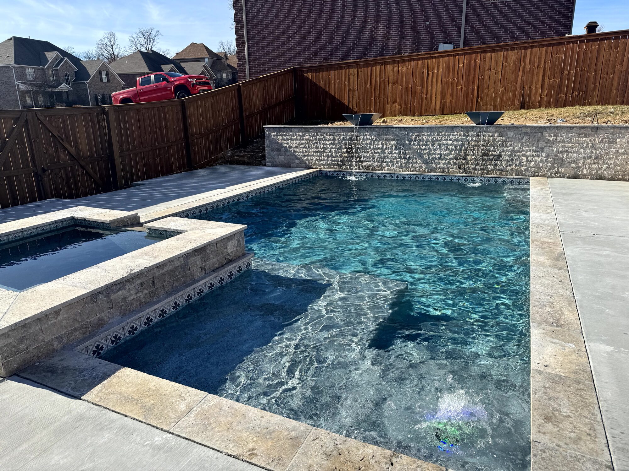 Gray pool with patterned waterline tile