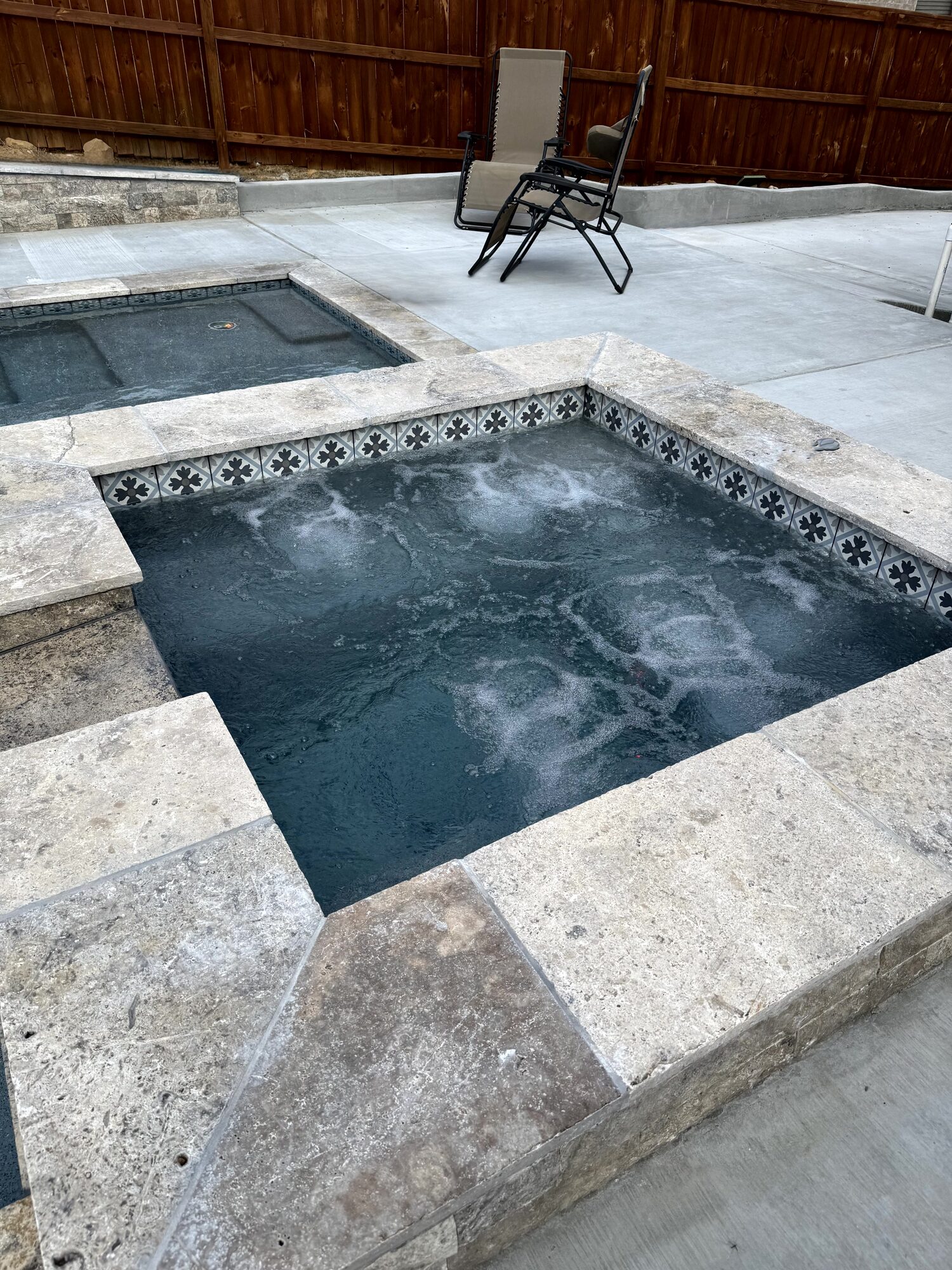 Travertine deck and pool detail